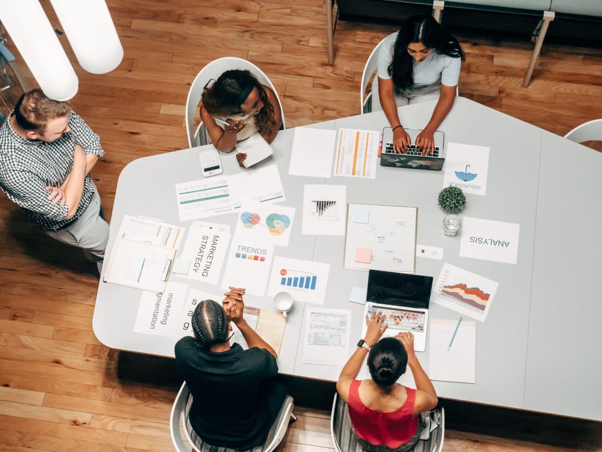 Hands working at a creative desk — atmospheric, not a client deliverable